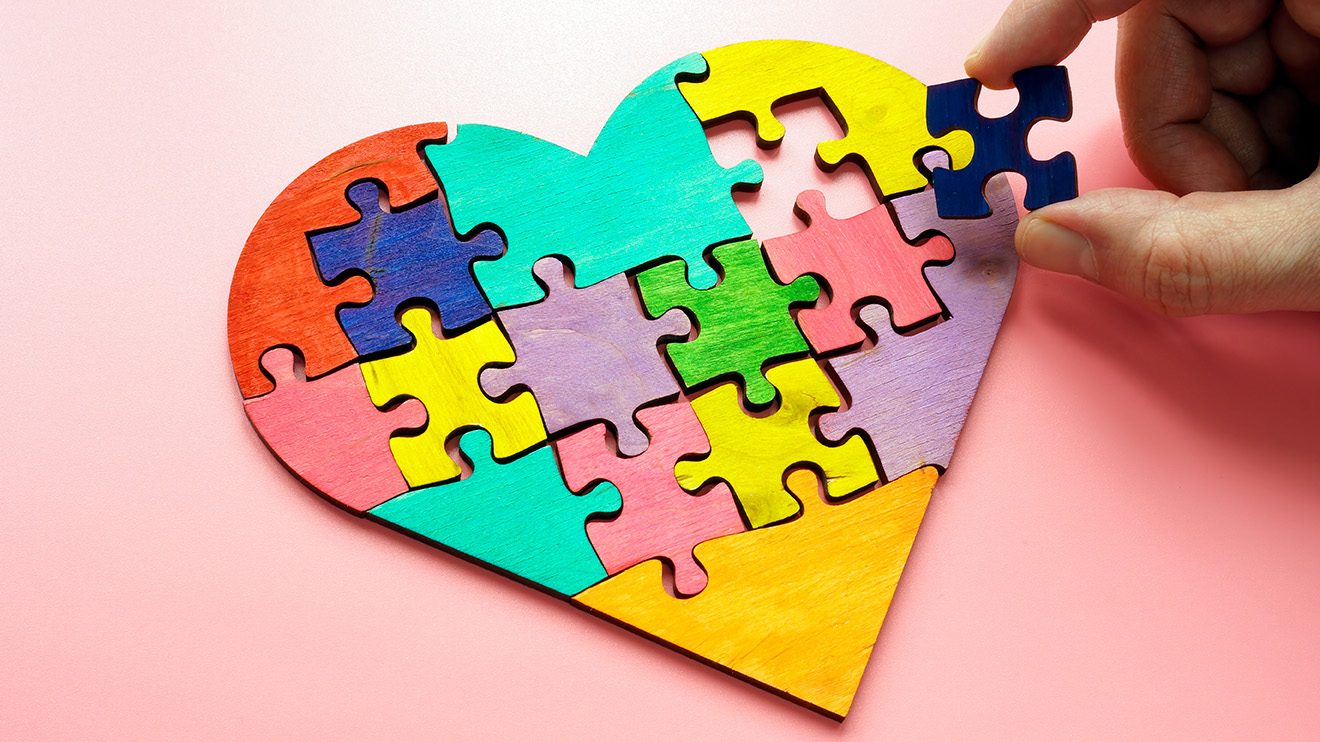 a heart shape created with puzzle pieces